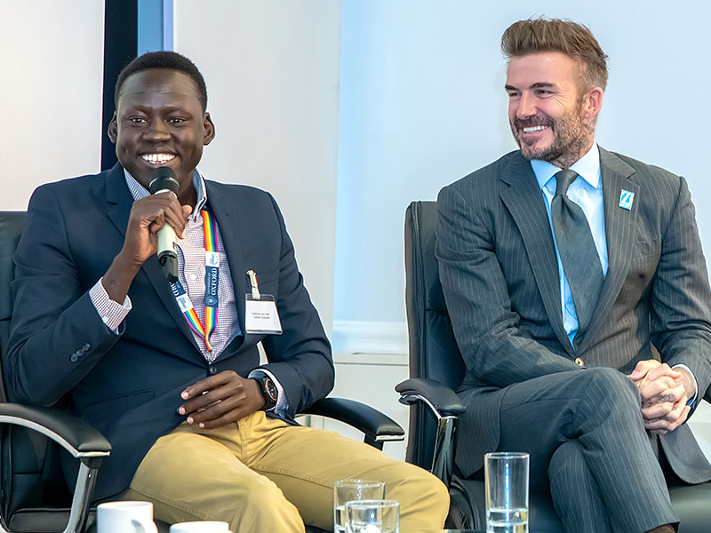 Lam Joar and David Beckham sit next to each other on stage during a panel event organised by Education Above All