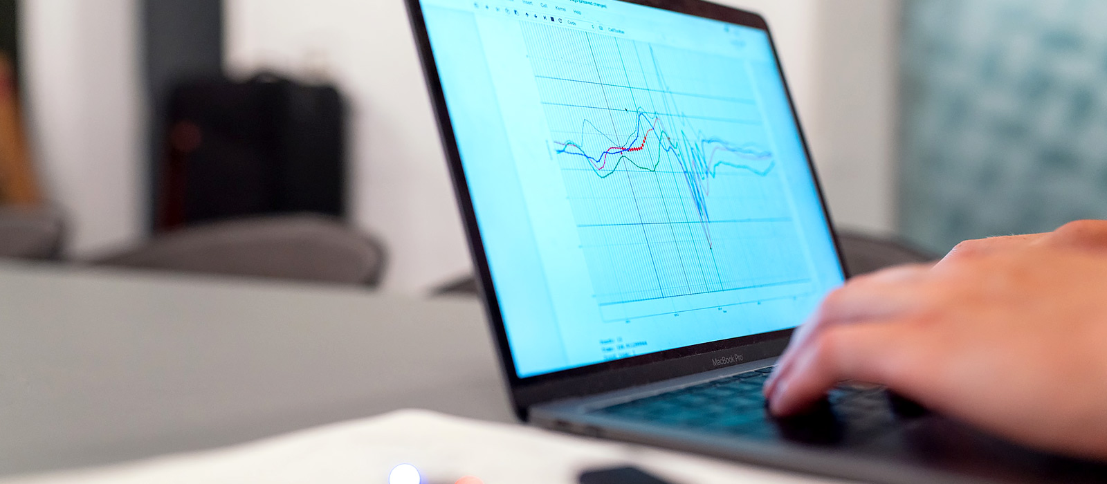 Laptop displaying graphs