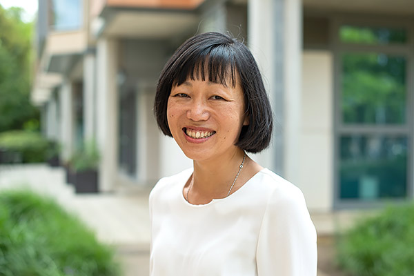 Bo Hu stands outside the University of Oxford China Centre in the gardens of St Hugh’s College