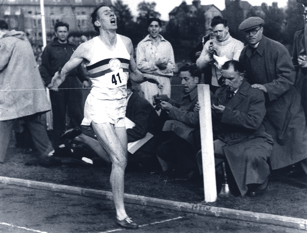 Sir Roger Bannister crossing the finish line to break the 4-minute-mile.