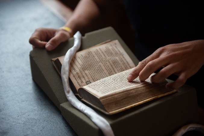 Scholar reading book from Bodleian Libraries