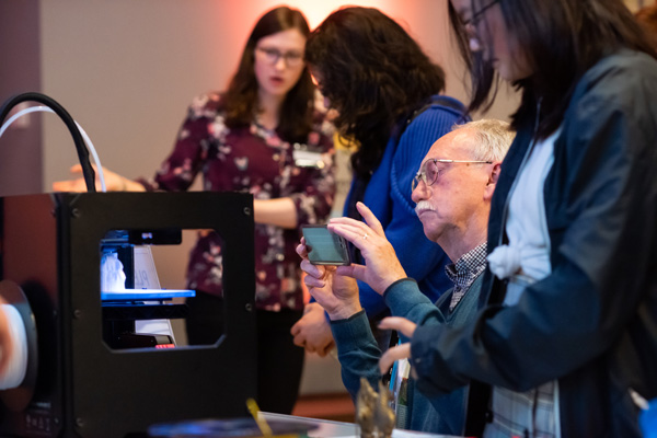 Visitors interacting with digital technologies during a ’Thinking 3D’ Bodleian Lates event