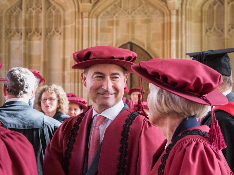 Christian Levett and other members of the Chancellor’s Court of Benefactors in the Divinity School. Photo by John Cairns.