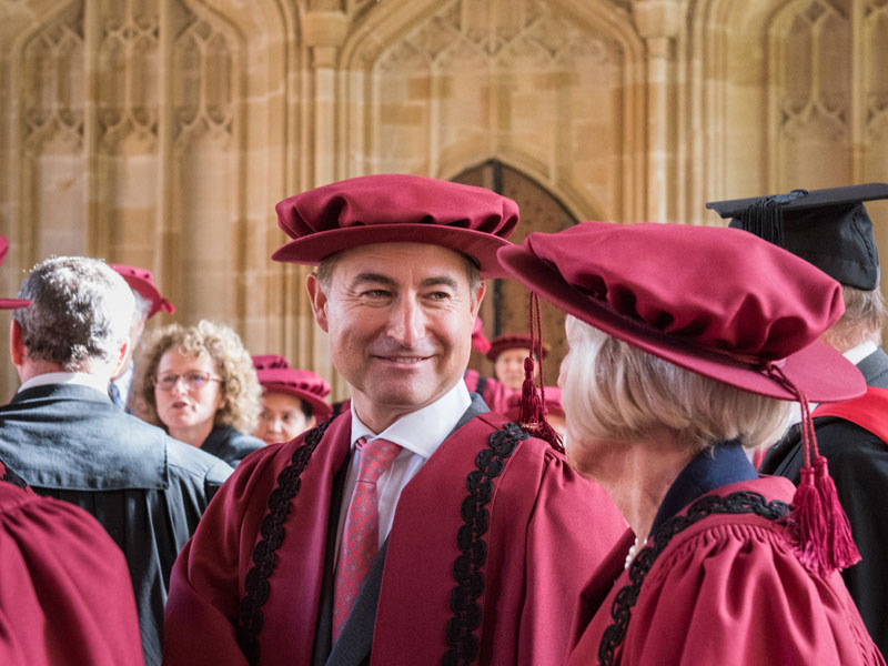 Christian Levett and other members of the Chancellor’s Court of Benefactors in the Divinity School. Photo by John Cairns.