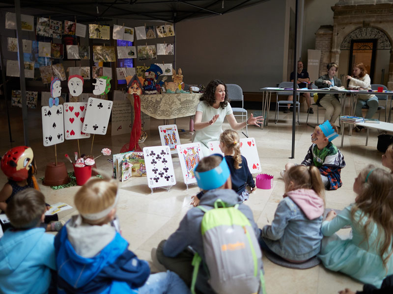 A storytelling session takes place in the Weston Library for Alice's Day. Photo by Ian Wallman