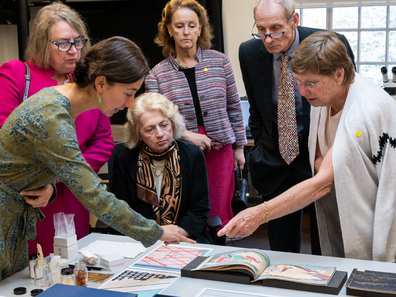Court members viewing treasures in the conservation studios of the Weston Library. Photo by César Manivet