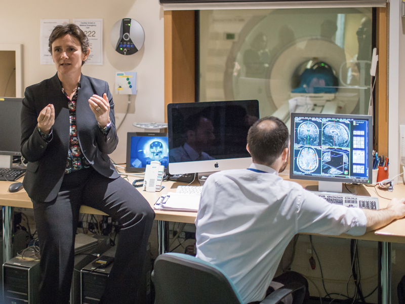 Professor Irene Tracey describes the brain images of a researcher undergoing an MRI scan. Photo by Ian Wallman.