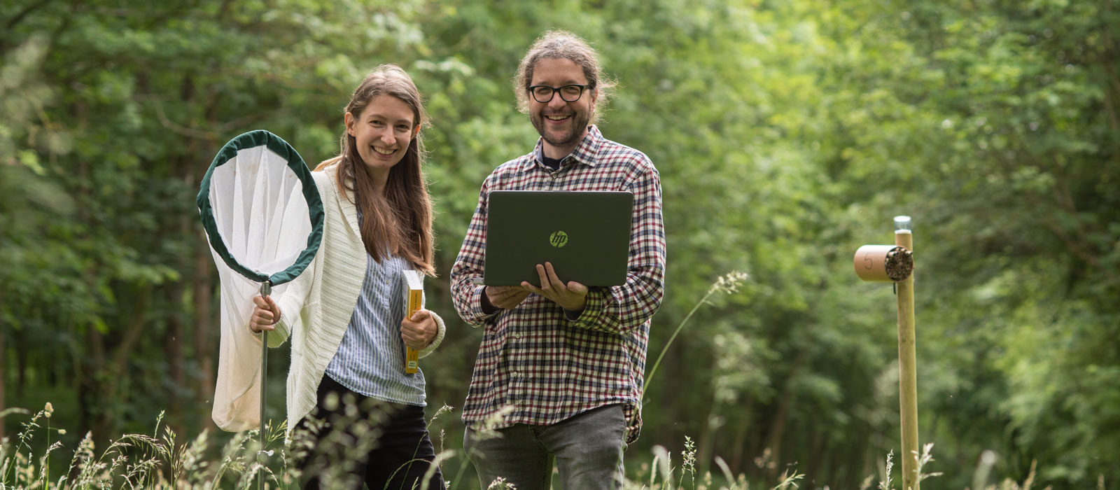 Dr Matthias Becher and Sabrina Dietz in Wytham Woods. Photo by John Cairns.