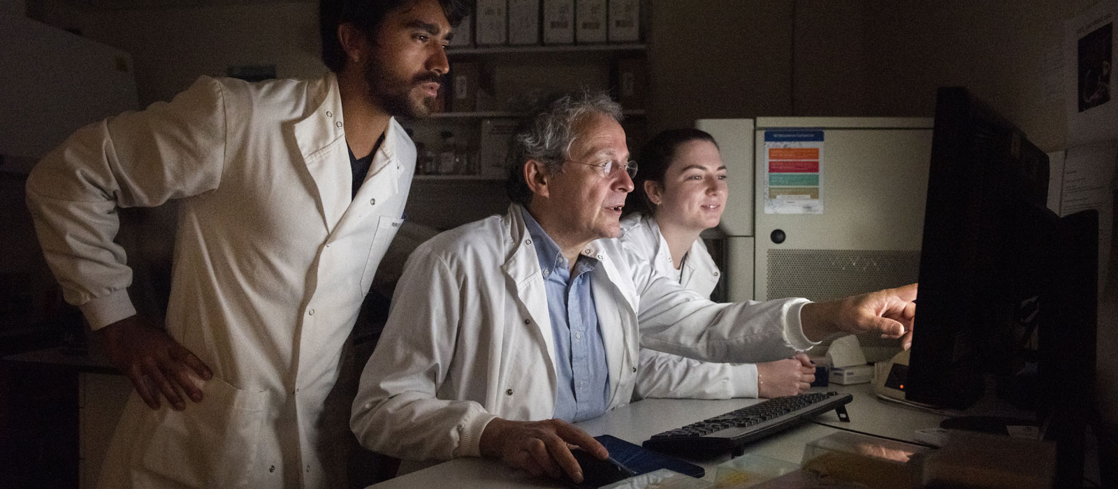 Professor Georg Holländer with research assistants Hector and Emma. Photo by John Cairns