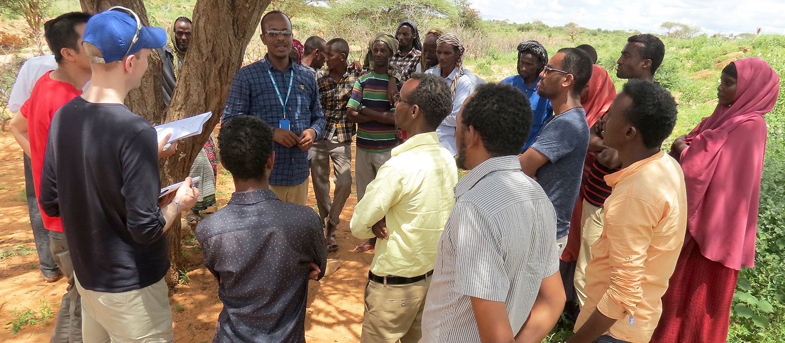 Professor Alex Betts in conversation with refugees in the Dollo Ado refugee camps in Ethiopia © Alex Betts