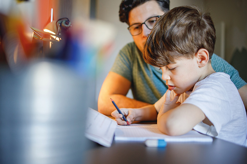 Boy and man at study