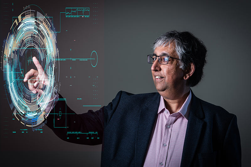 Professor Chas Bountra uses a floating digital touchscreen 