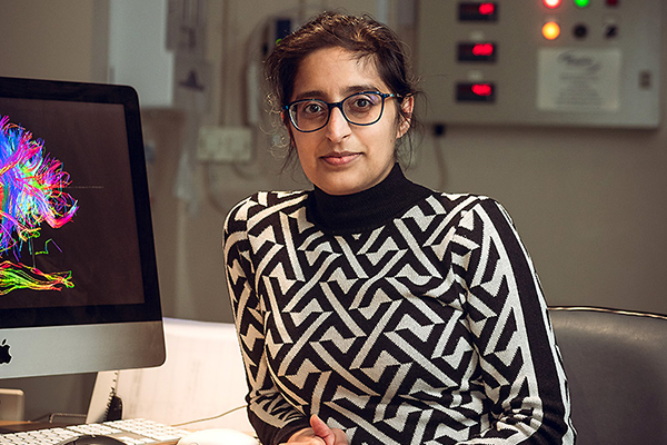 Dr Jasleen Jolly with a patient in an MRI scanner control room at the Wellcome Centre for Integrative Neuroimaging, a multi-disciplinary neuroimaging research facility at the University of Oxford