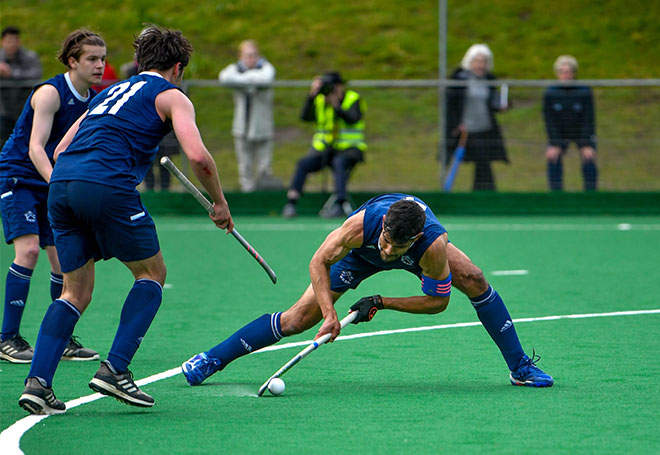 OUHC Men’s Blues team playing at the 2021 Varsity match. Photo credit: Erin Forsyth
