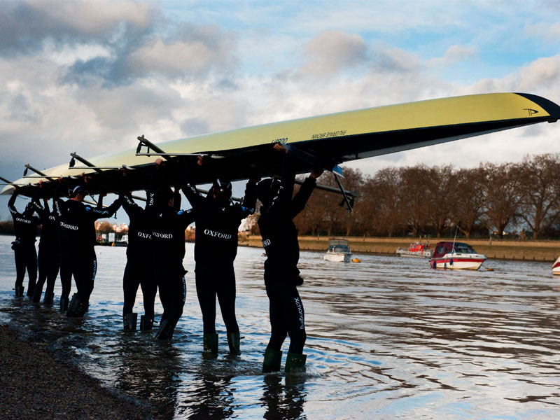 Student rowers carry their boat, often known as a 'shell', to the river. Image © Oxford University Images / Rob Judges Photography